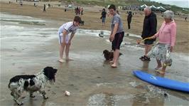 Ash and Zac enjoy talking to a couple and their two delightful dogs on Perranporth Beach 